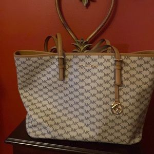 Michael Kors hangbag- large with lots of additional pockets for storage.